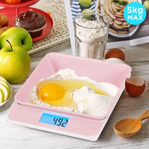 Duronic Digital Kitchen Scales weighing flour and a raw egg, reading 492 grams, 5kg capacity.