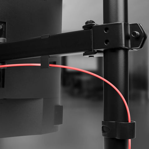 Duronic Dual Monitor Stand featuring integrated cable management clips routing a red wire.