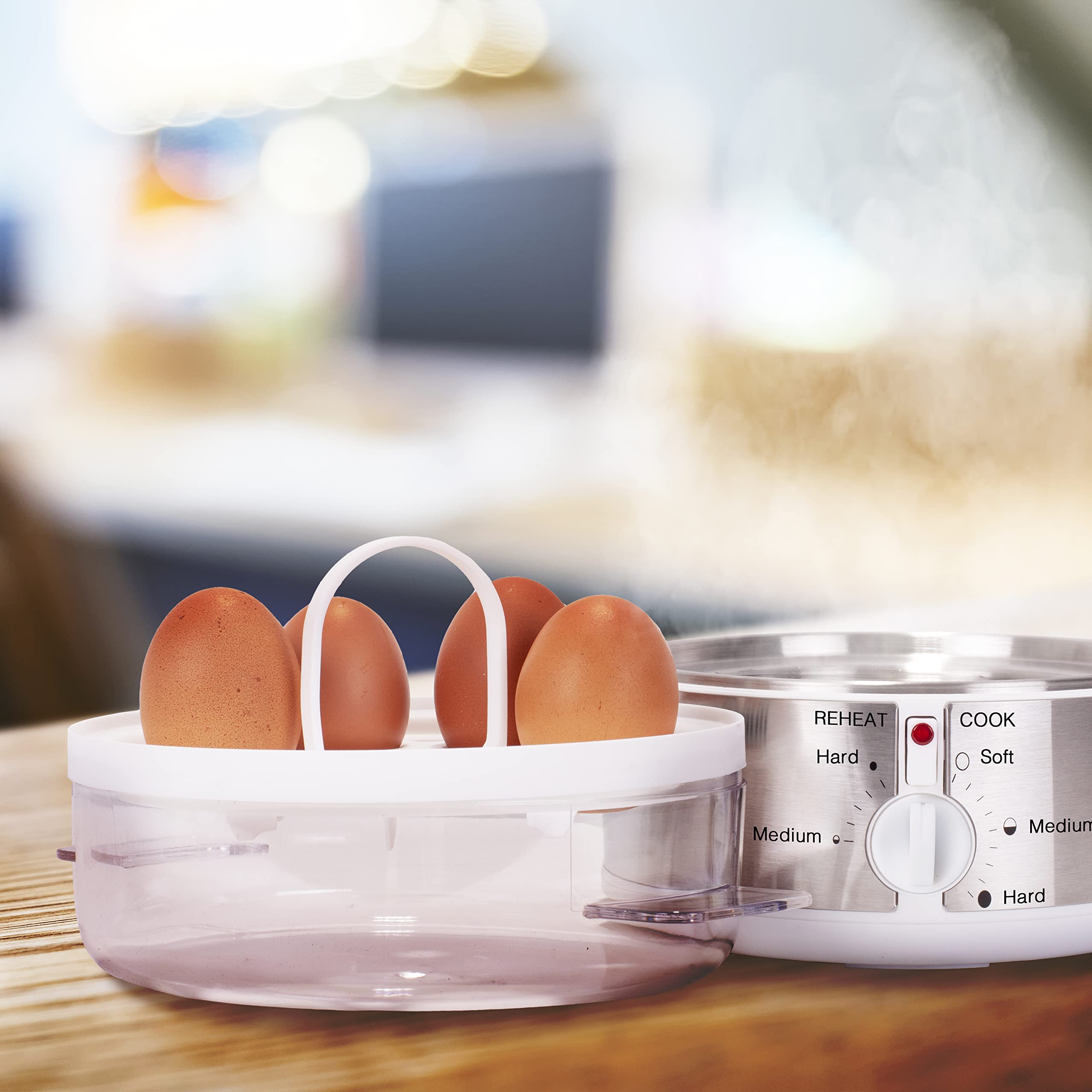 Duronic EB35 WE electric egg boiler placed on countertop ready to cook 4 out of 7 eggs 