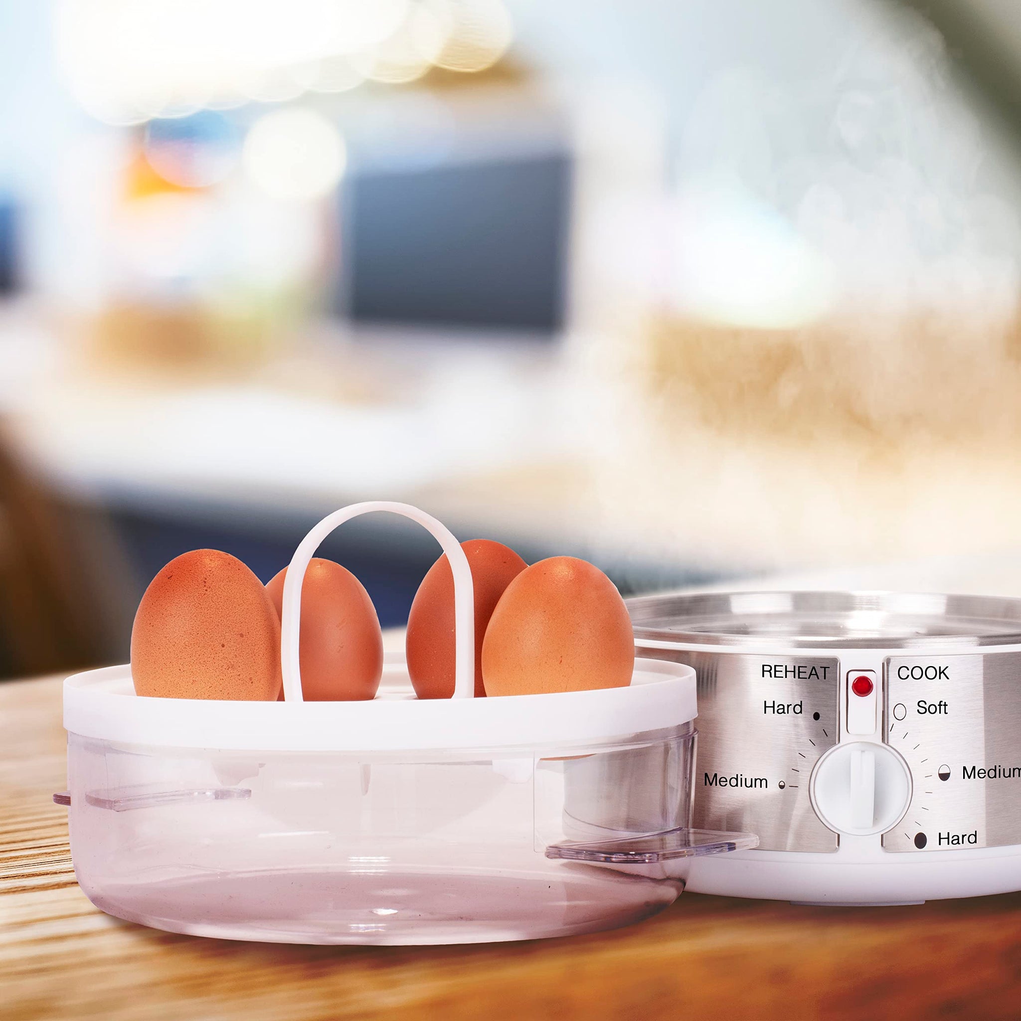 Duronic EB35 WE electric egg boiler placed on countertop ready to cook 4 out of 7 eggs 