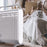 Duronic Electric Heater next to a woman reading with a fluffy cat.