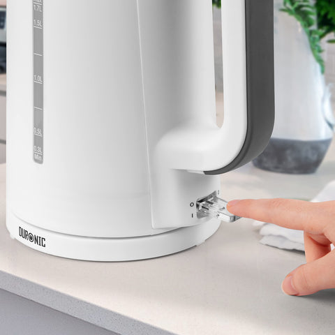 Duronic Electric Kettle with water level window being switched on by a person’s finger.