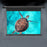 Duronic Electric Projector Screen showing a vibrant image of a sea turtle swimming in turquoise water.