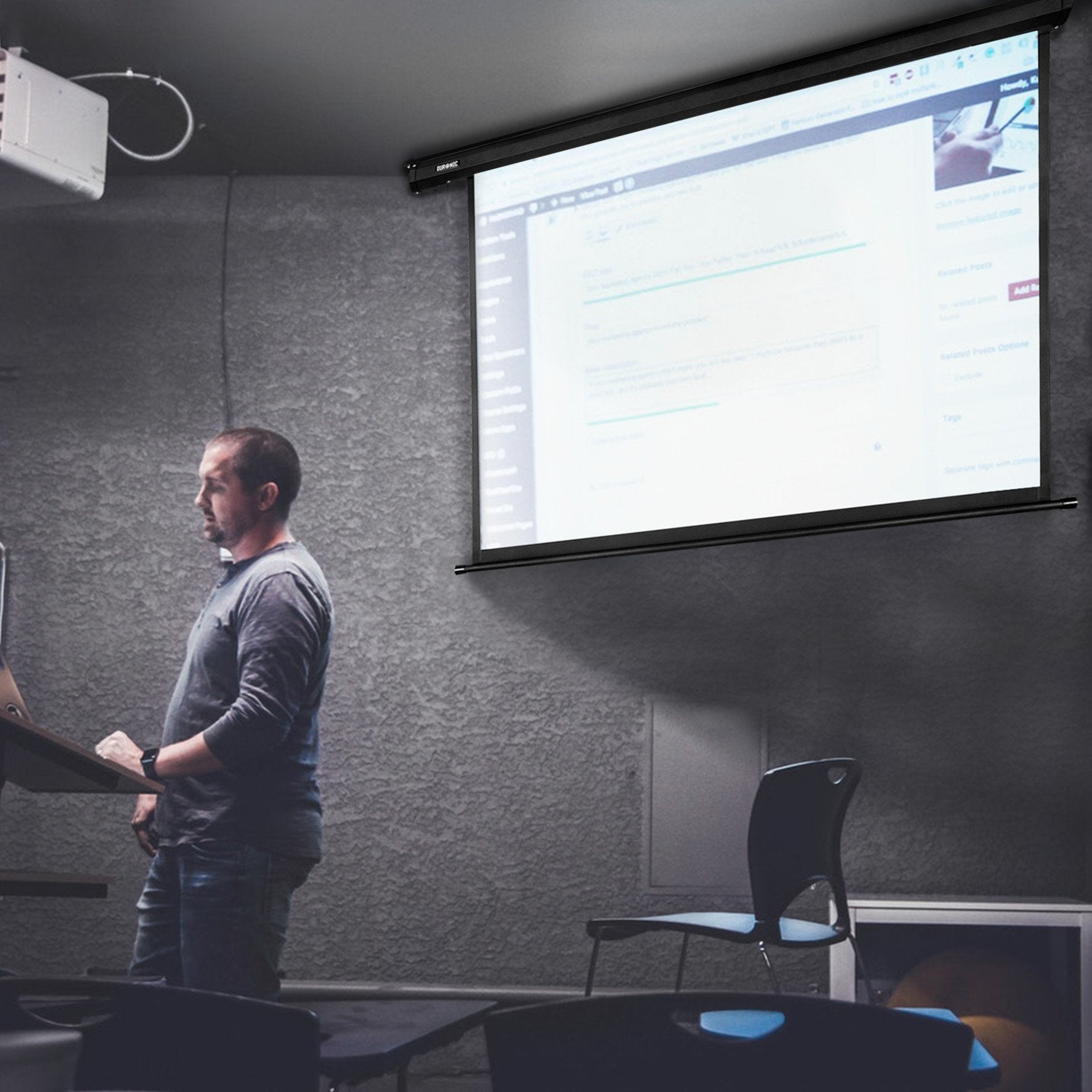 Duronic Electric XXL Projector with a man presenting in a podium
