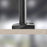 Duronic Grommet 3 clamped securely onto a light wood grain desk surface against blurred background.