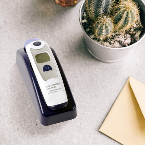 Duronic IRT1000 dual mode thermometer placed on stand provided for easy access placed on table