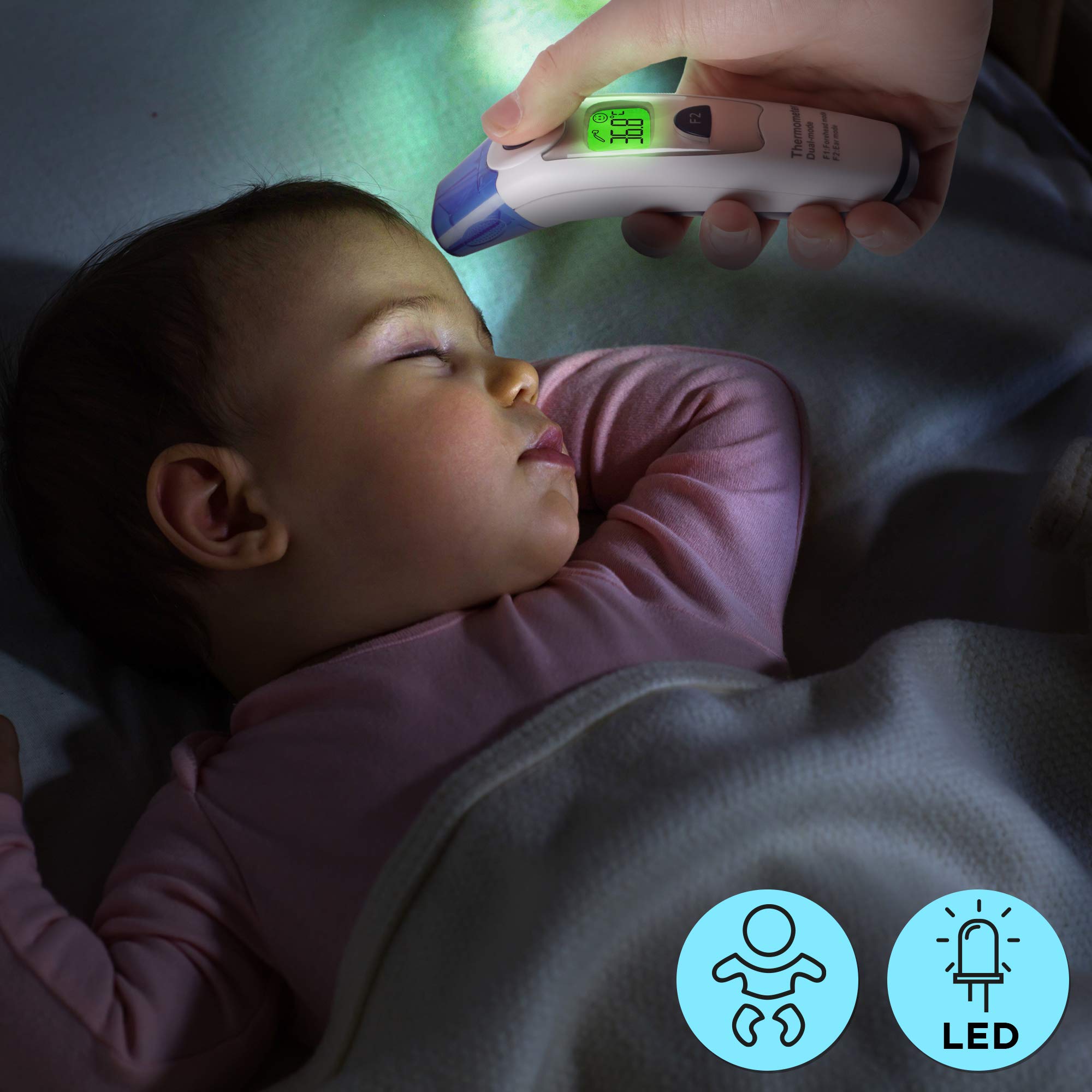 Duronic IRT1000 forehead thermometer scanning a baby's forehead while sleeping to see if temperature is optimal