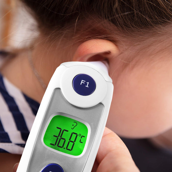Duronic IRT1000 infrared ear thermometer in use scanning a child's ear for temperature