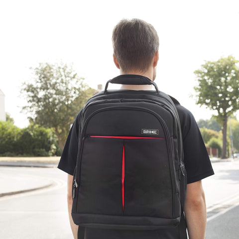 Duronic Laptop Backpack with red zipper accents, walking down an outdoor street.