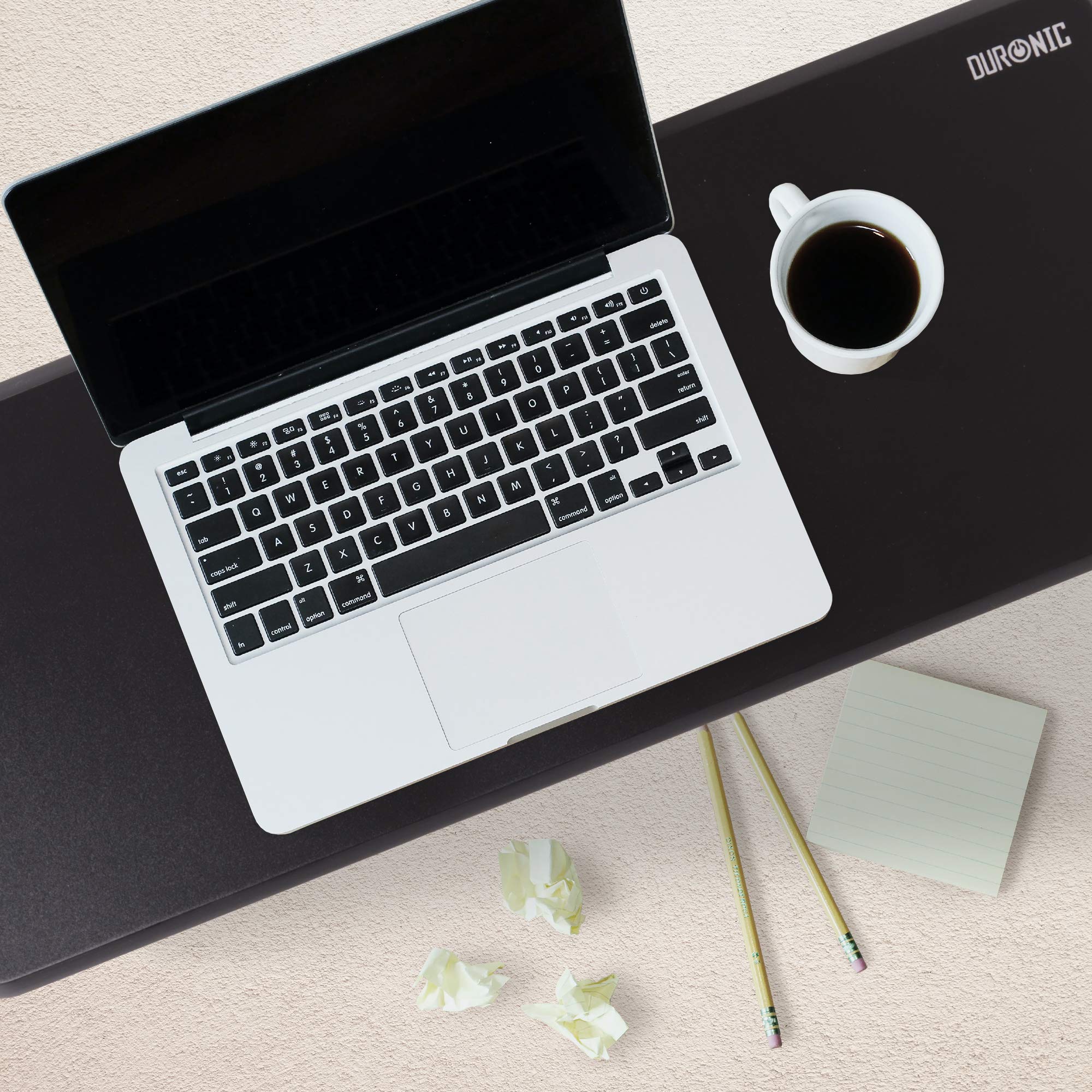 Duronic Monitor Stand Riser featuring a white laptop, a coffee mug, pencils, and notepad.