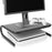 Duronic Monitor Stand Riser holding a computer screen and white controller over a game console.