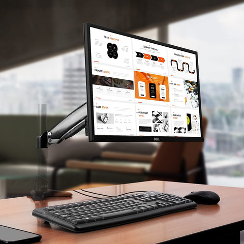 Duronic Monitor Stand Spare Arm holding a Dell screen over a wooden office desk.