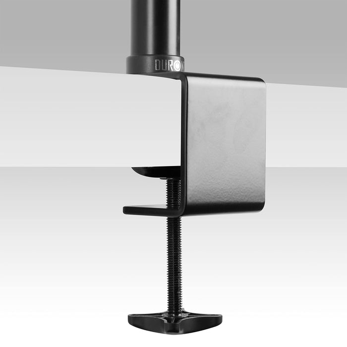 Duronic POLE securely attached to a white desktop surface for monitor arm stability.