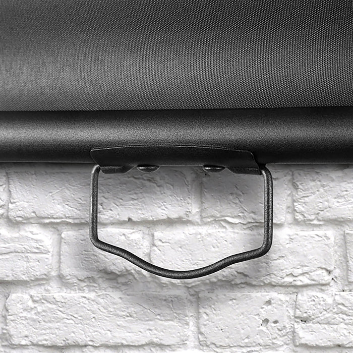 Duronic Projector Screen with Close up view of a black metal handle on a projector screen against white brick.