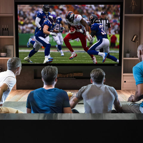 Duronic Projector Screen with four men sitting on a couch watching an American football