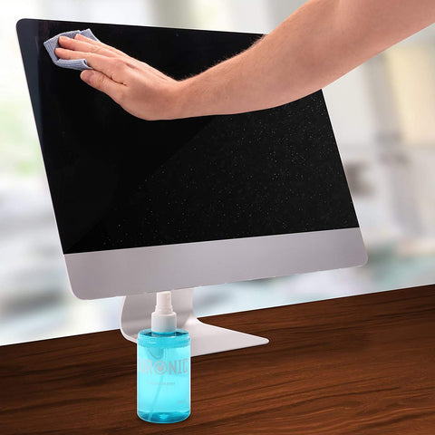 Duronic Screen Cleaner with Hand wiping a computer screen with a microfiber cloth next to a blue spray bottle.