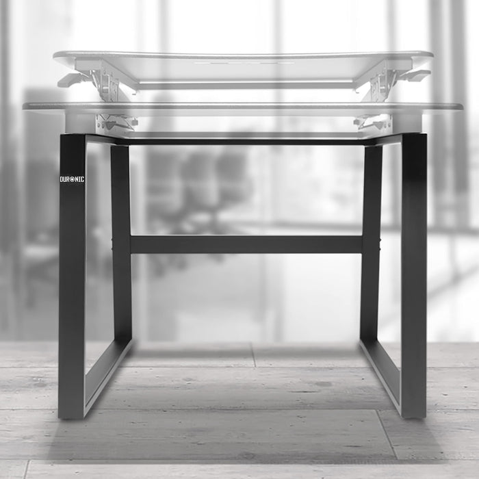 Duronic Sit-Stand Desk Frame featuring black metal legs on a wooden floor.