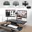 Duronic Sit-Stand Desk attached to a standing desk converter via a grommet hole installation.