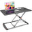 Duronic Sit-Stand Desk featuring a height-adjustable silver X-frame base, shown holding a laptop and a cup of coffee.