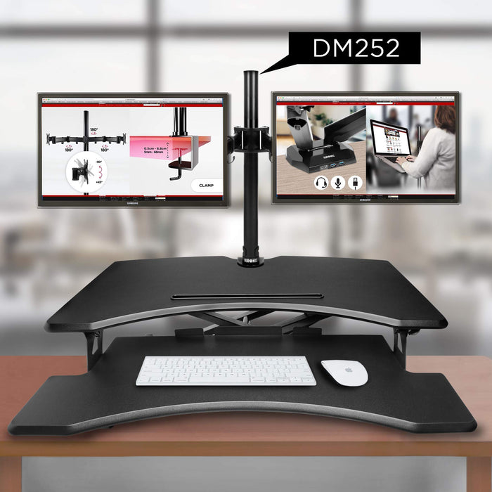 Duronic Sit-Stand Desk holding two screens above a black sit-stand desk converter.