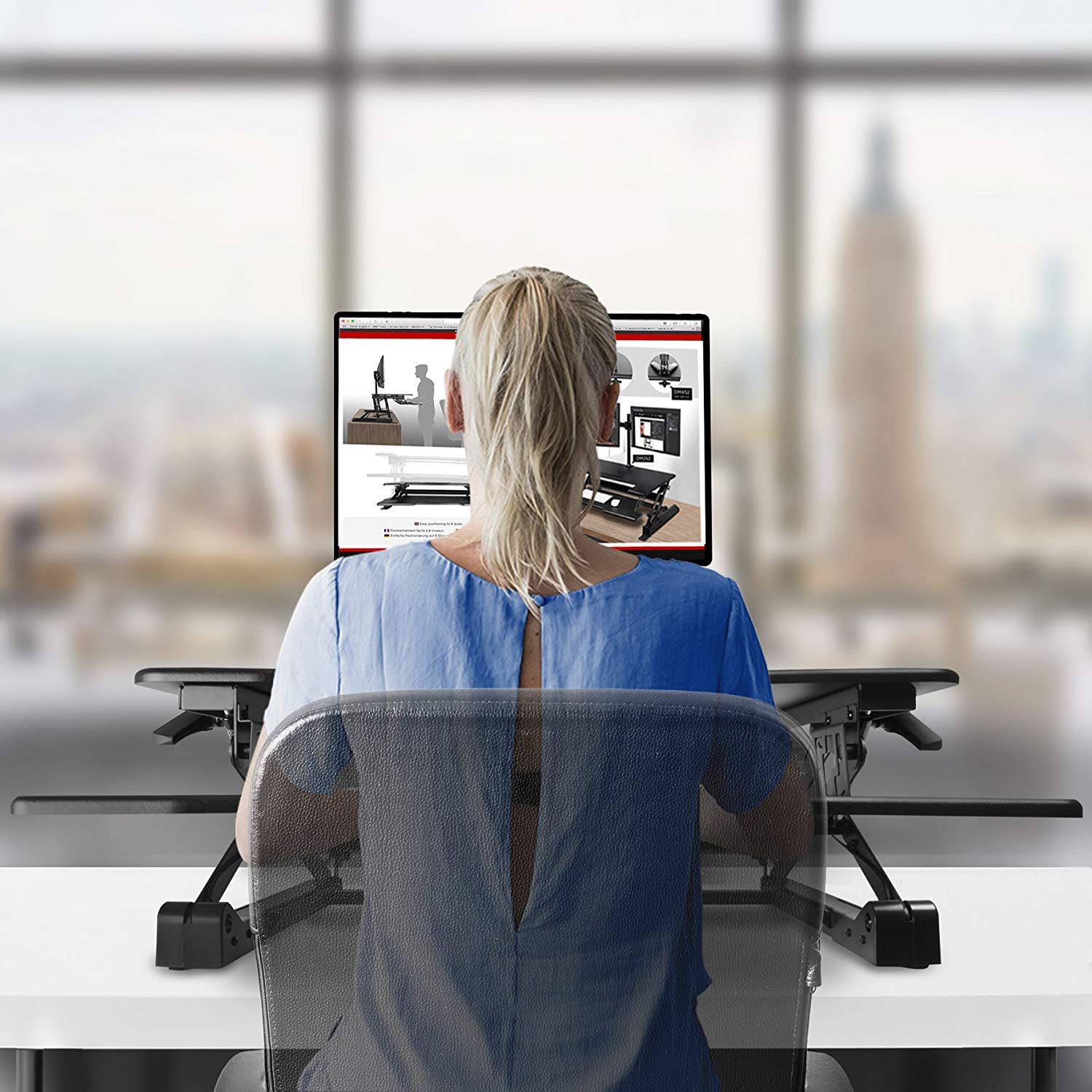 Duronic Sit-Stand Desk using an adjustable desktop standing desk converter.