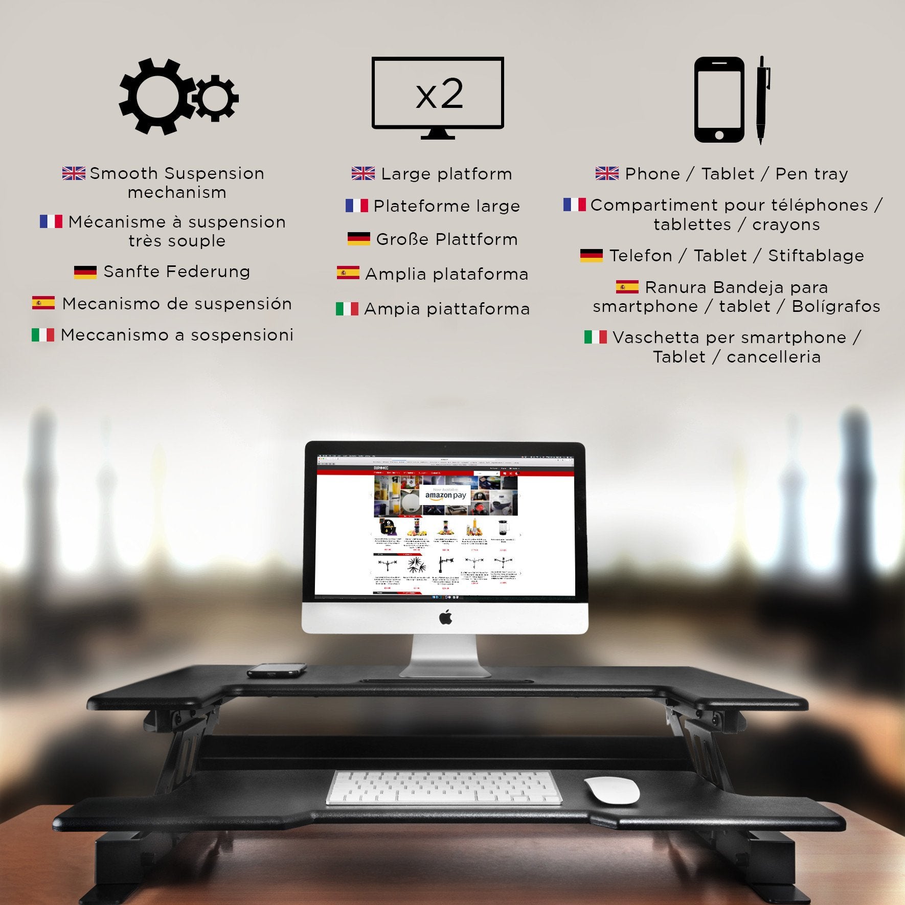 Duronic Sit-Stand Desk with a computer, dual monitor capacity, keyboard tray, and smartphone holder.