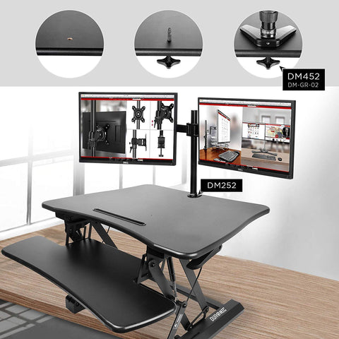 Duronic Sit-Stand Desk with dual monitor mount installed via a grommet hole.