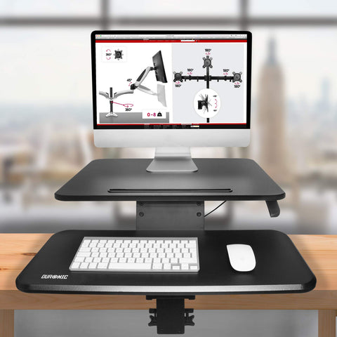 Duronic Sit-Stand Desk with keyboard tray clamped to wooden table holding a computer.