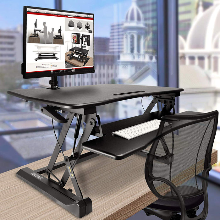 Duronic Sit-Stand Desk with keyboard tray, monitor mount, and mesh office chair.
