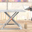 Duronic Sit-Stand Desk with x-shaped silver legs on a wooden office tabletop background.