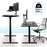 Duronic Sit Stand Desk Frame shown in both sitting and standing positions with a 220lbs weight capacity.