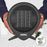 Duronic Small Ceramic Fan Heater lightweight black circular design held in two hands for scale.