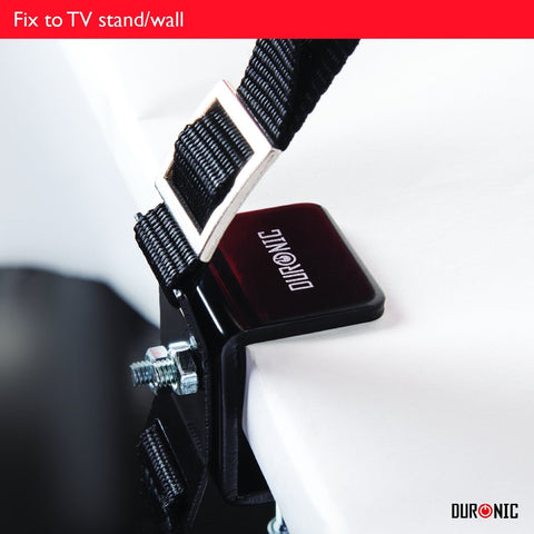 Duronic TV stand safety strap featuring a heavy-duty black metal clamp secured to a white desk.
