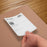 Duronic Thermal Labels with A person's hand placing a label onto a box