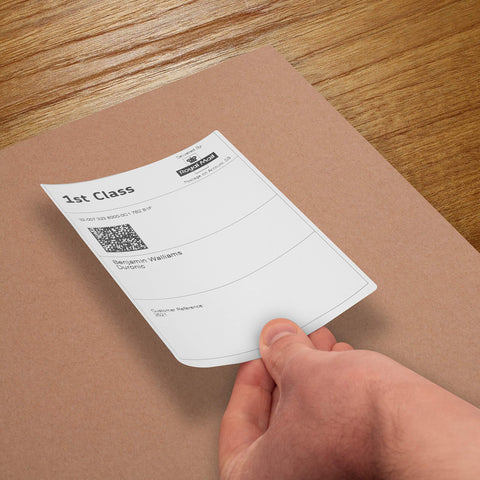 Duronic Thermal Labels with A person's hand placing a label onto a box