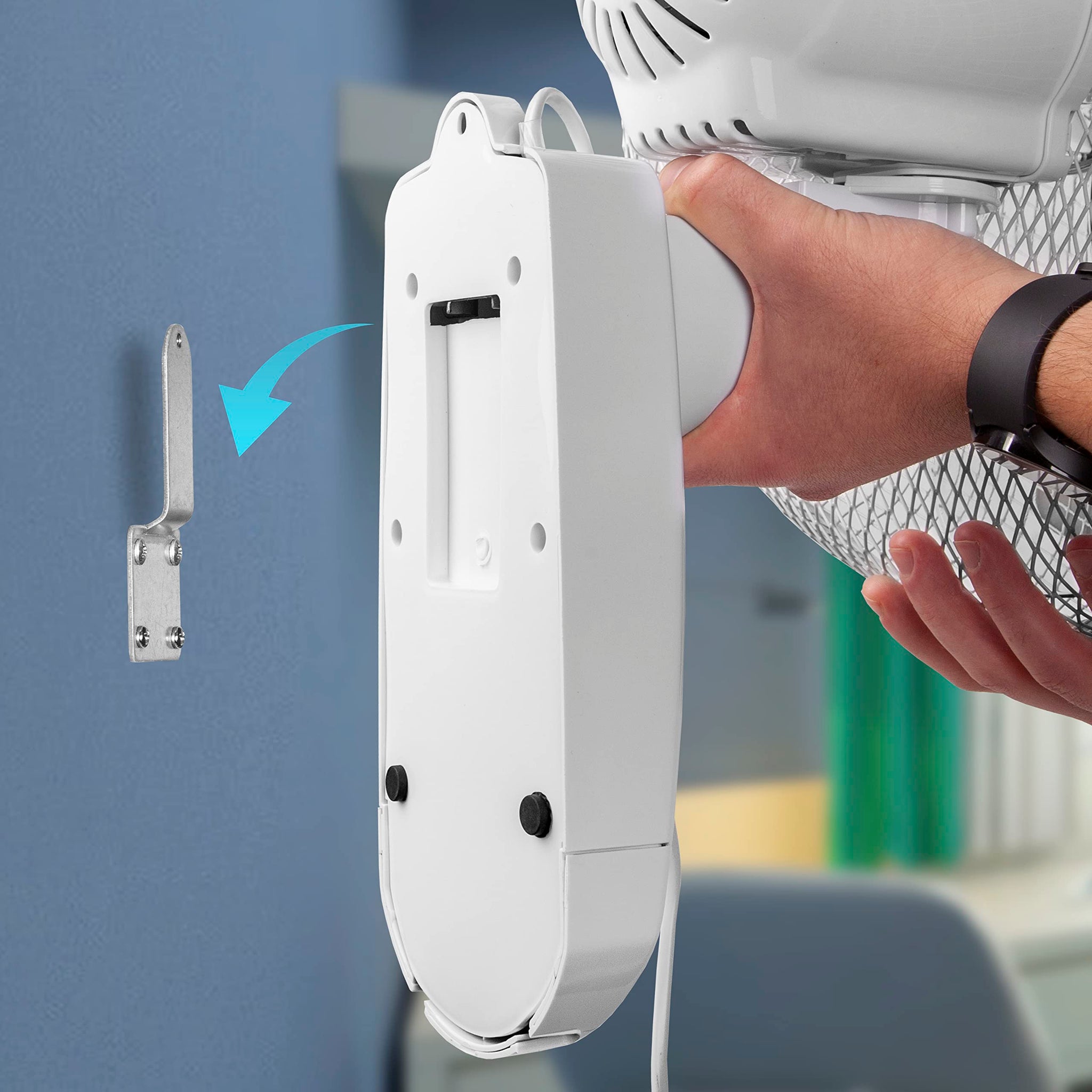 Duronic Wall Mounted Fan with hand holding to align with a silver metal mounting bracket.