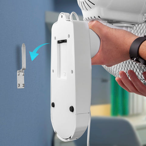 Duronic Wall Mounted Fan with hand holding to align with a silver metal mounting bracket.