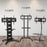 Three mobile TV stands (TVS4T1, TVS5T1, TVS3F1) in black and chrome on wood flooring.